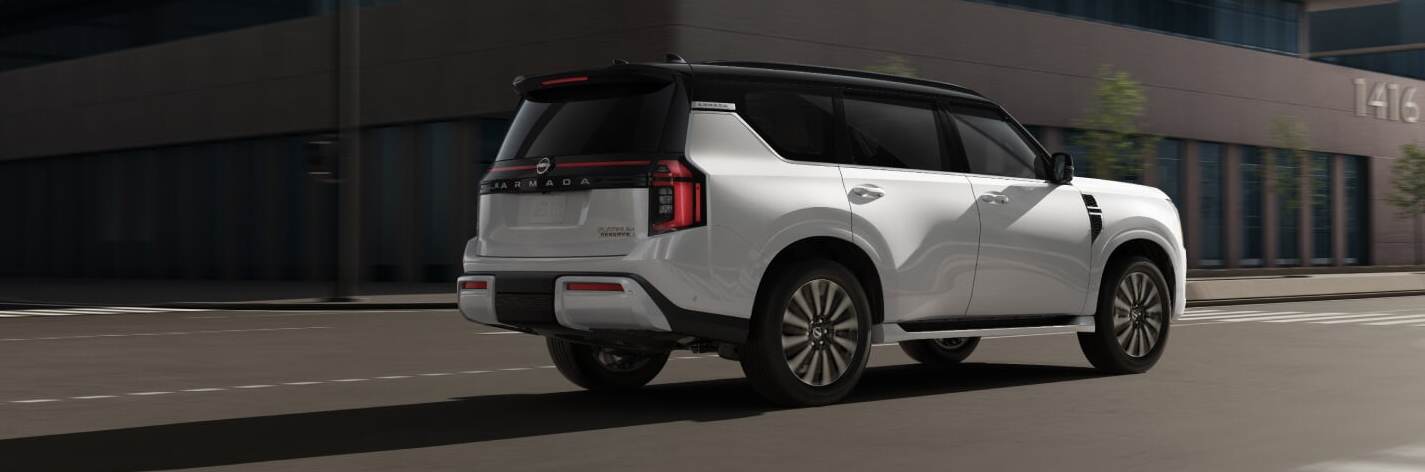 Rear side view of 2026 Nissan Armada driving
